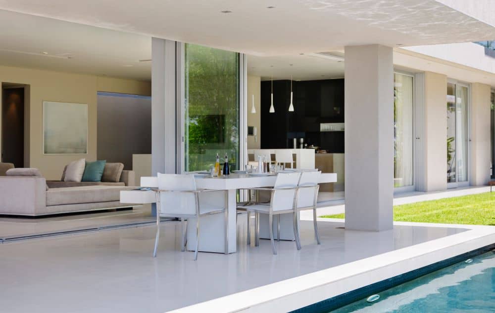 In addition to serving as a gathering zone for lounging and entertaining, concrete patios allow homeowners to seamlessly blend interior and exterior living spaces.